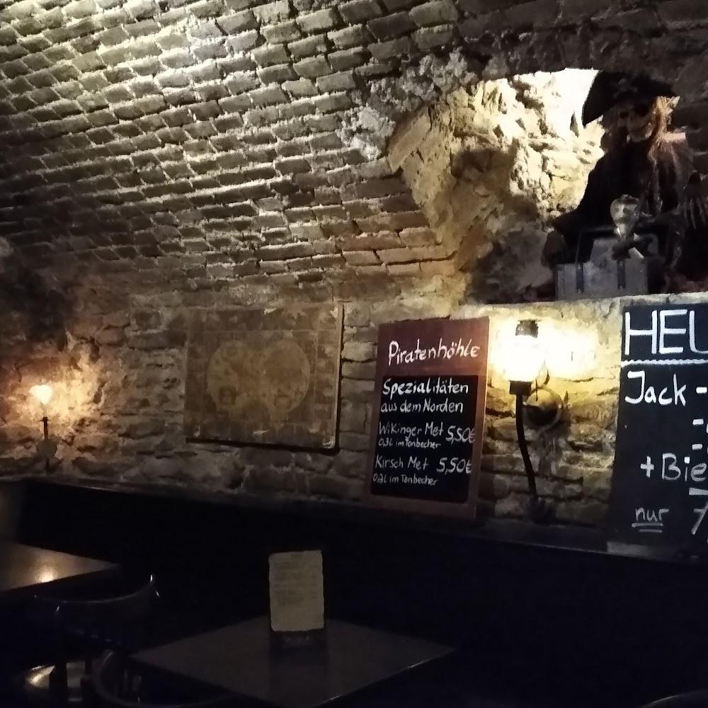 Brick wall with a sign for a bar called